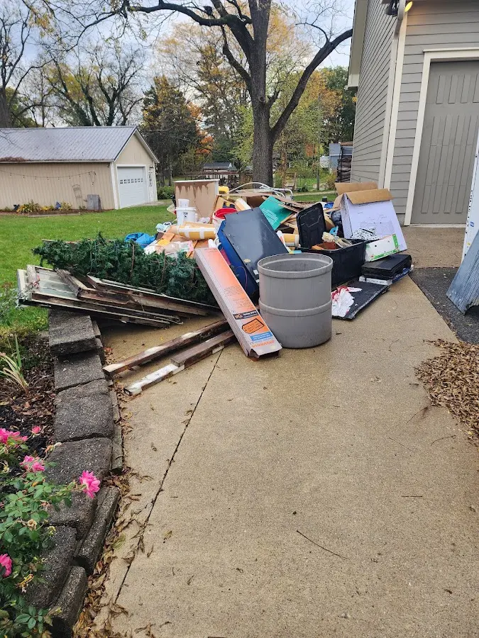 Dumpster being loaded with debris for Residential Dumpster Rental in Marietta-Alderwood